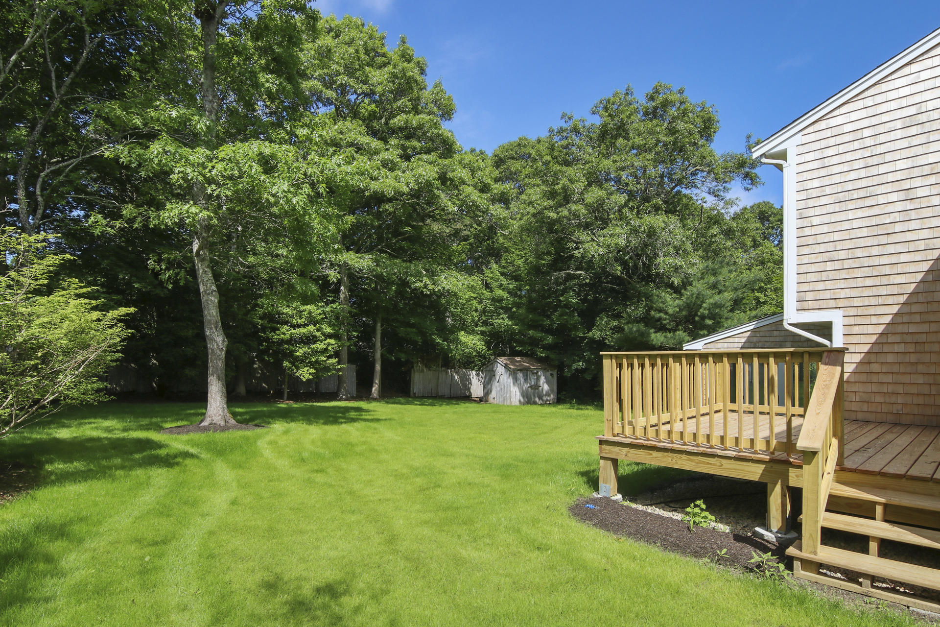 725 Old Stage Road Centerville, MA 02632 - Photo 40 of 53 a view of a chair and table in the yard