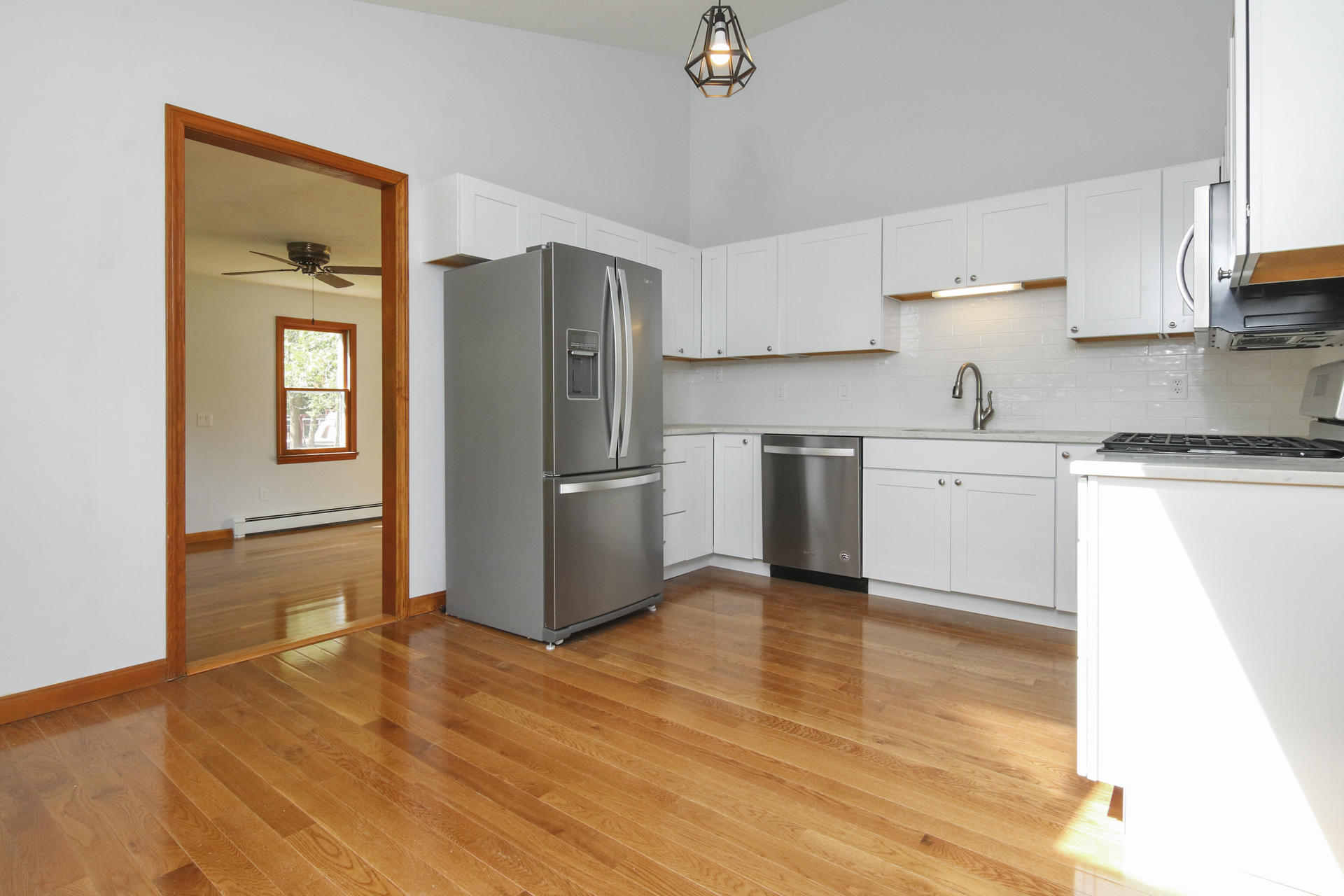 725 Old Stage Road Centerville, MA 02632 - Photo 8 of 53 a kitchen with granite countertop a refrigerator and a stove top oven