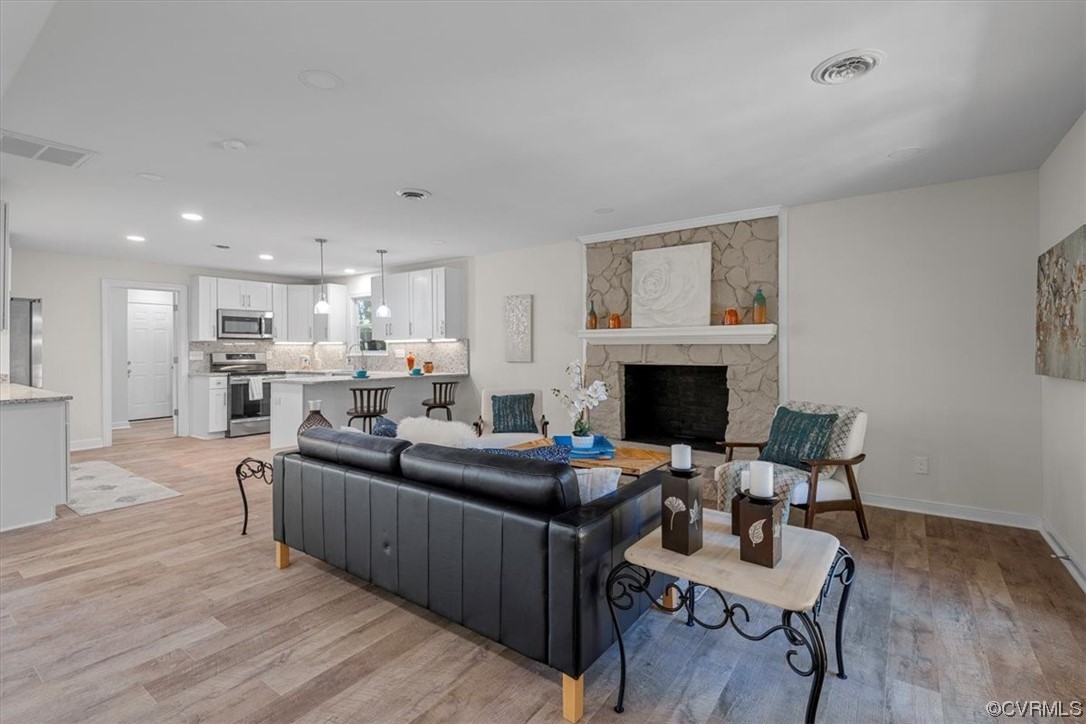 13109 Bluemont Road Chester, VA 23831 - Photo 12 of 50 a living room with furniture a fireplace and a flat screen tv