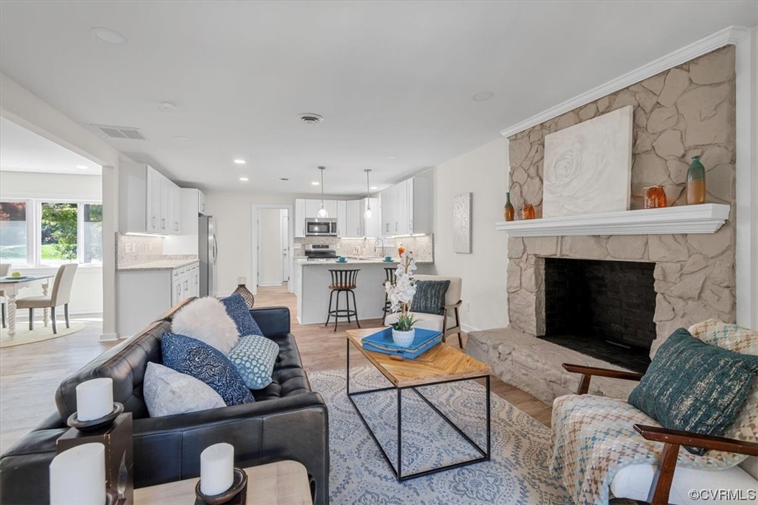13109 Bluemont Road Chester, VA 23831 - Photo 15 of 50 a living room with furniture and a fireplace
