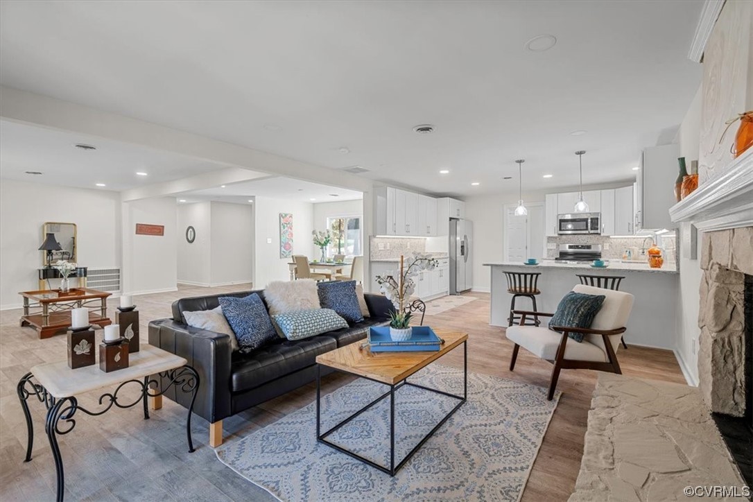 13109 Bluemont Road Chester, VA 23831 - Photo 16 of 50 a living room with furniture a kitchen view and a dining table