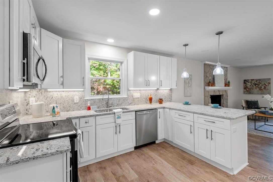 13109 Bluemont Road Chester, VA 23831 - Photo 21 of 50 a kitchen with a sink stove and cabinets