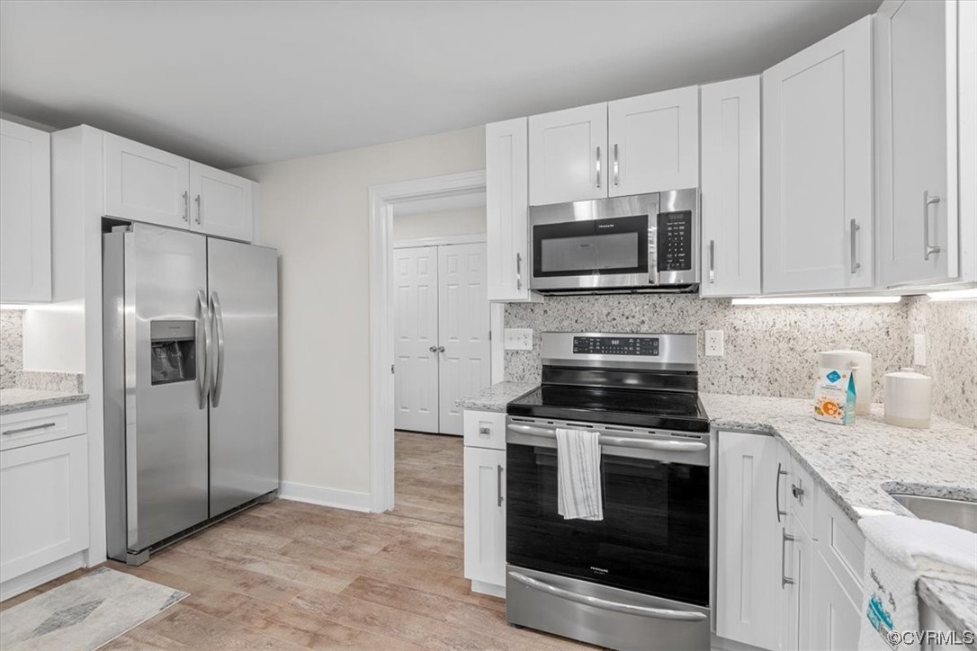 13109 Bluemont Road Chester, VA 23831 - Photo 25 of 50 a kitchen with cabinets stainless steel appliances and a counter top space