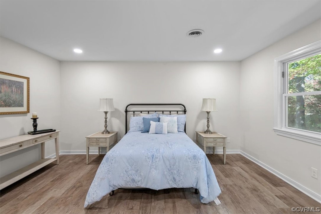 13109 Bluemont Road Chester, VA 23831 - Photo 32 of 50 a bedroom with a bed and a night stand