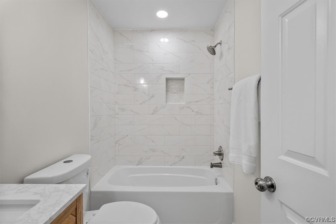 13109 Bluemont Road Chester, VA 23831 - Photo 40 of 50 a bathroom with a granite countertop bathtub shower sink vanity and toilet