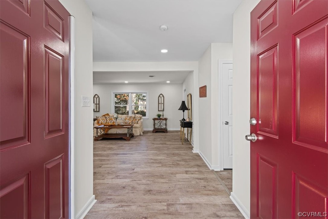 13109 Bluemont Road Chester, VA 23831 - Photo 4 of 50 a hall way with furniture a mirror and a wooden furniture