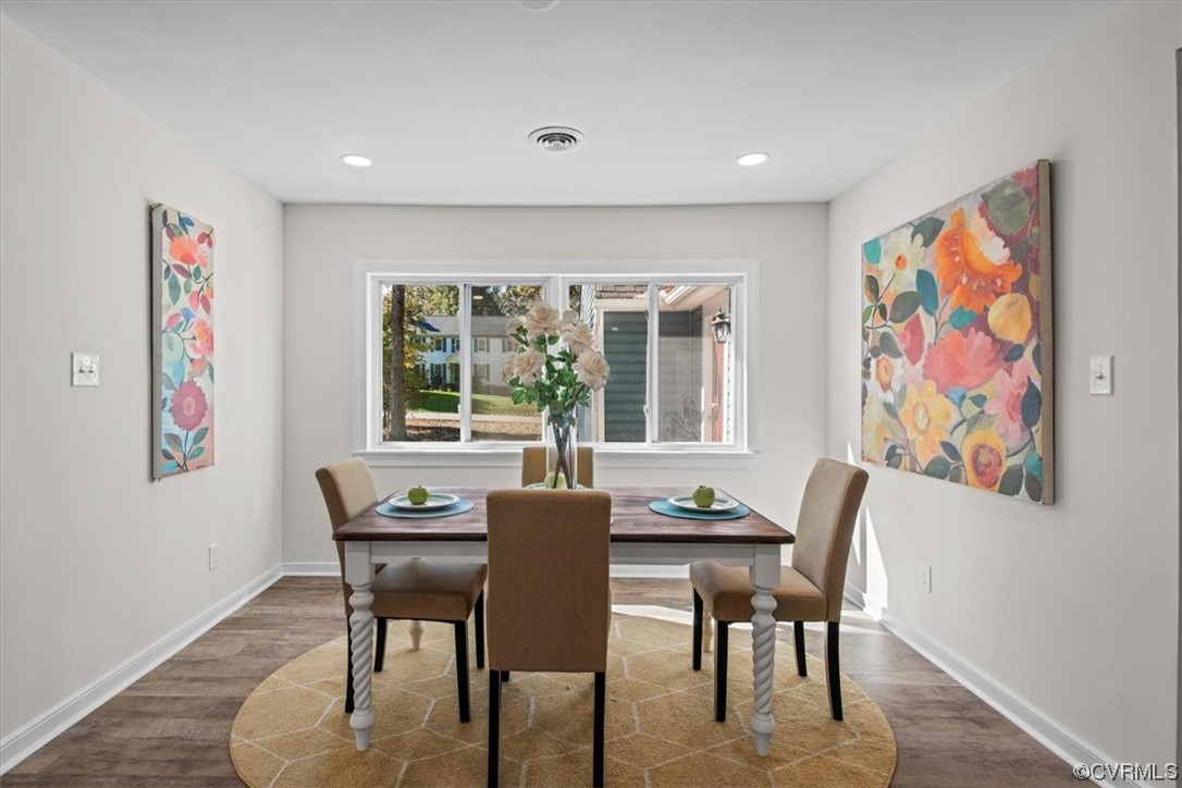 13109 Bluemont Road Chester, VA 23831 - Photo 10 of 50 a view of a dining room with furniture a rug and wooden floor