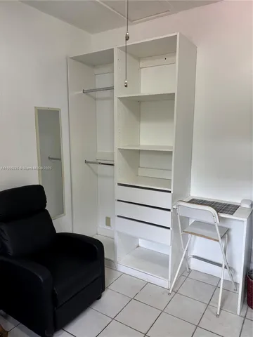 a room with a closet and a chair