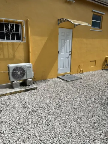 a wooden door in front of a building