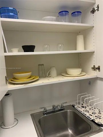 a close view of sink and cabinets