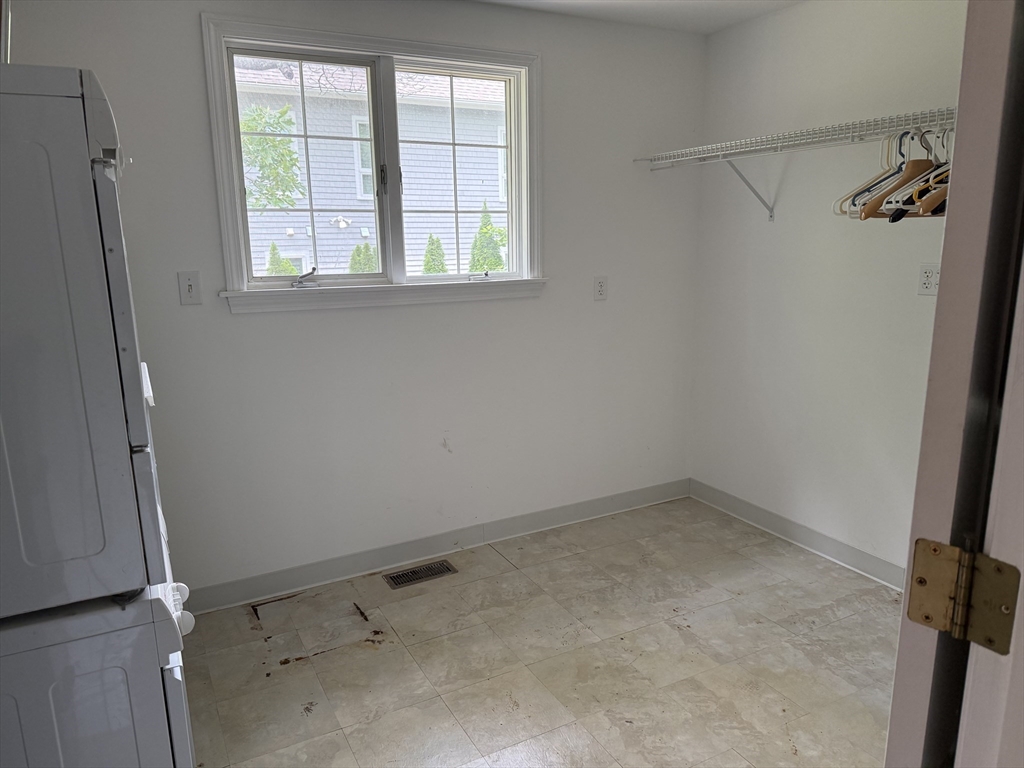 183 Monomoscoy Road Mashpee, MA 02649 - Photo 11 of 22 an empty room with a window