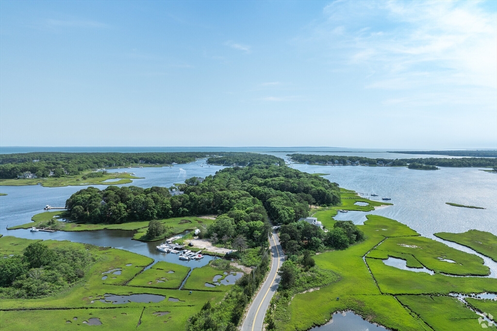183 Monomoscoy Road Mashpee, MA 02649 - Photo 19 of 22 an aerial view of a golf course with chairs