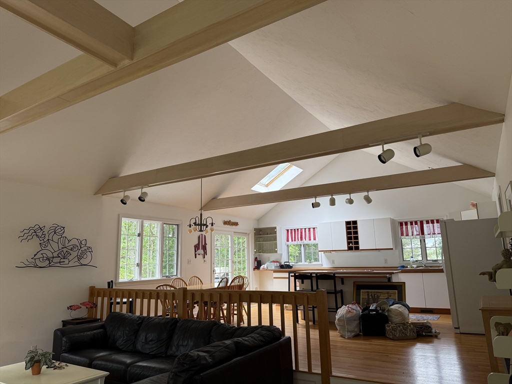 183 Monomoscoy Road Mashpee, MA 02649 - Photo 3 of 22 a living room with furniture and a large window