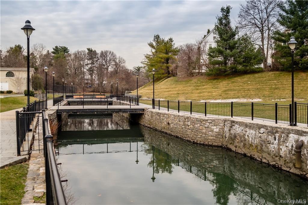 107 Kensington Road, Unit 5 Bronxville, NY 10708 - Photo 16 of 17 Dock area with a water view and view of scattered trees