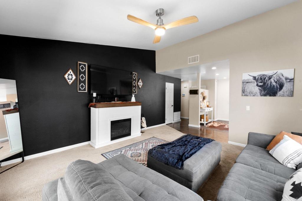 333 Sunflower Escondido, CA 92026 - Photo 15 of 36 a living room with furniture and a fireplace