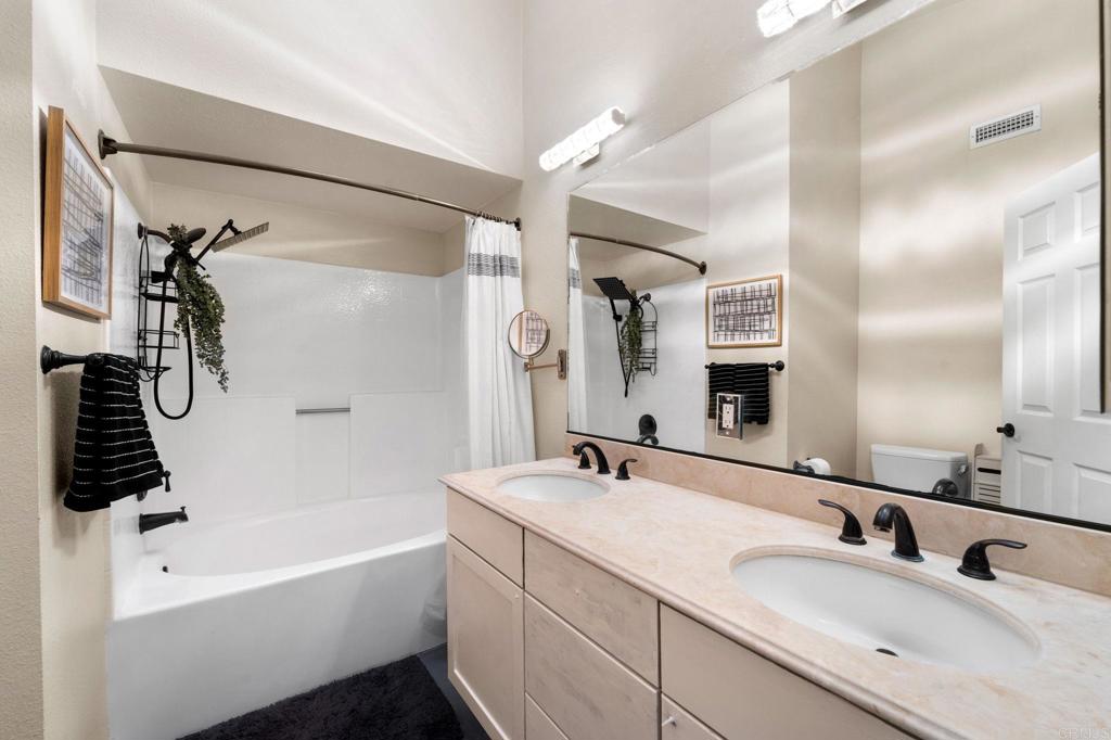 333 Sunflower Escondido, CA 92026 - Photo 22 of 36 a bathroom with a tub a sink and mirror