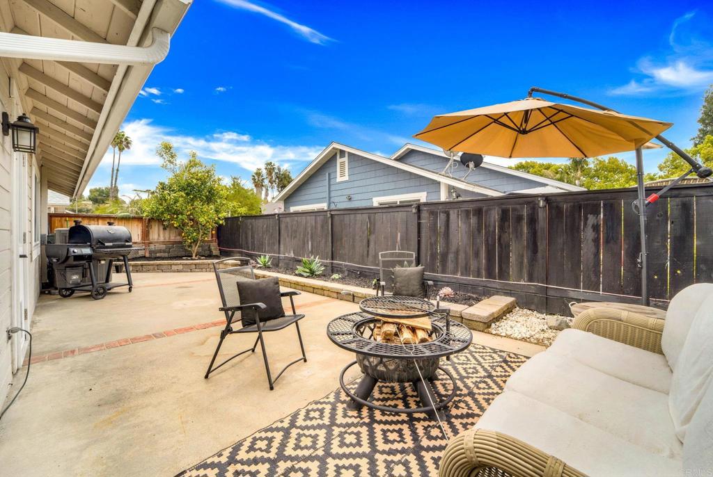 333 Sunflower Escondido, CA 92026 - Photo 25 of 36 a backyard of a house with table and chairs