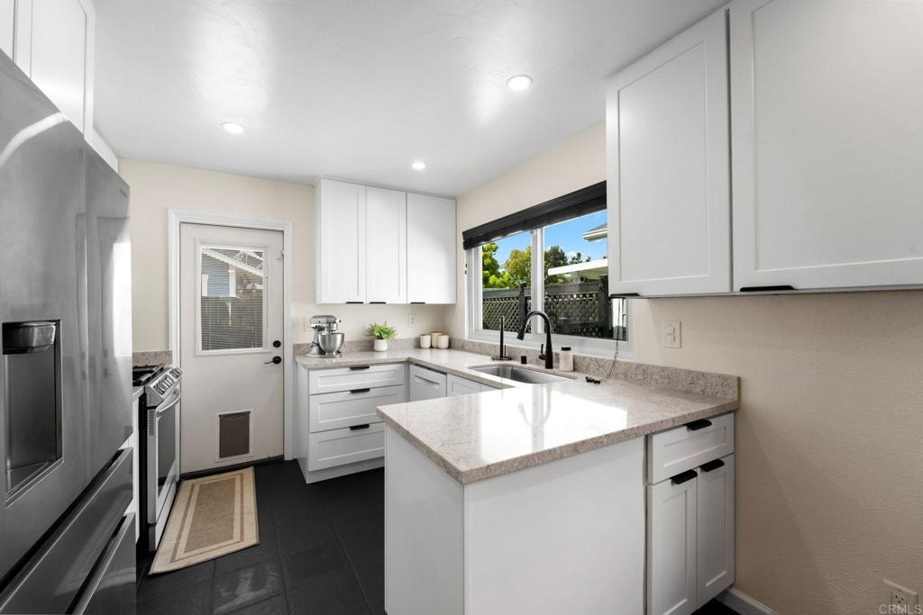 333 Sunflower Escondido, CA 92026 - Photo 6 of 36 a kitchen with a sink stove and cabinets
