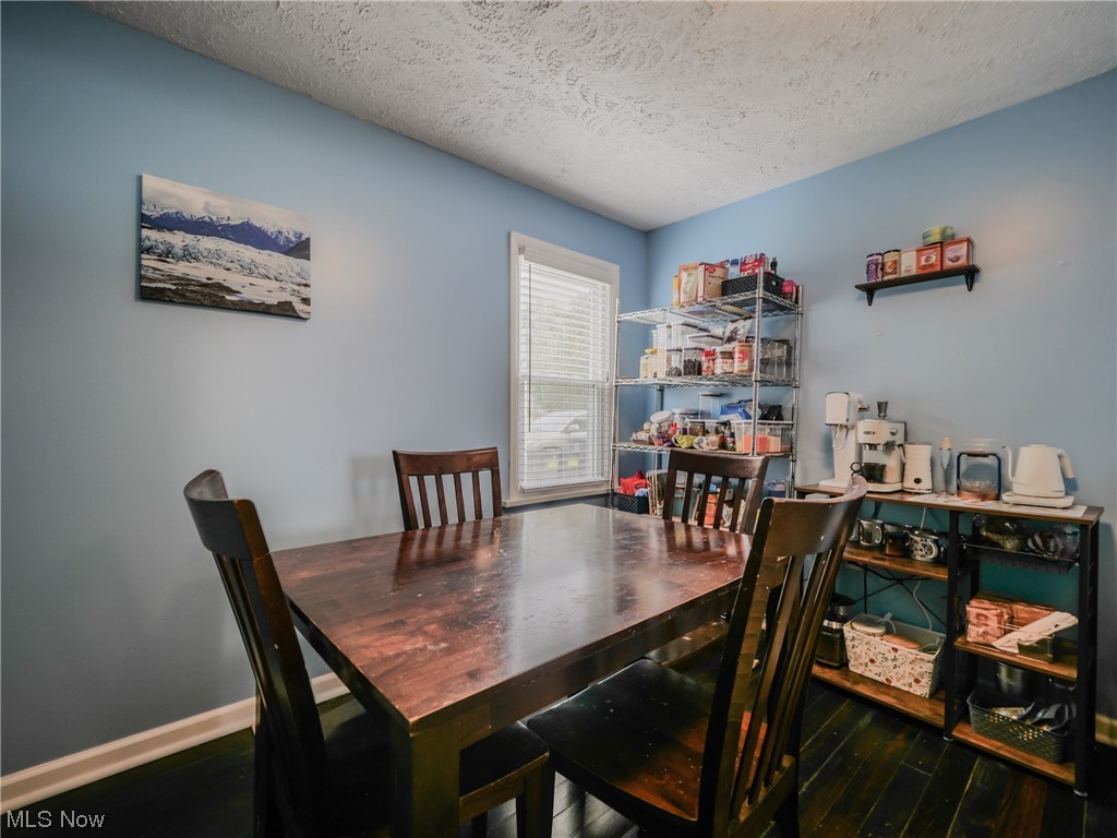 1240 Churchill Road Lyndhurst, OH 44124 - Photo 9 of 30 Hardwood floored dining space with a textured ceiling