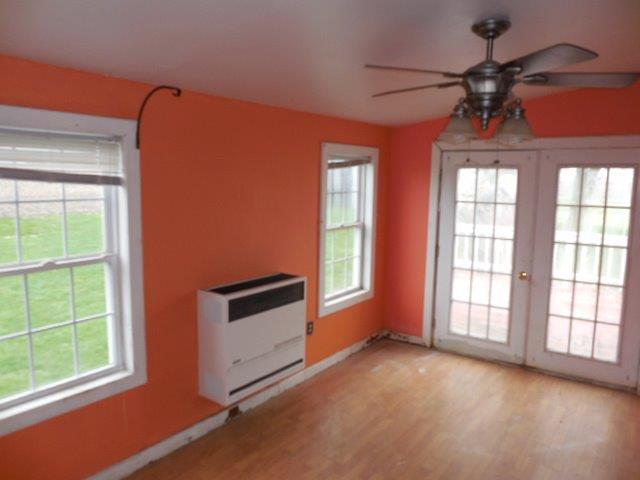 488 County Road 2100 North Danforth, IL 60930 - Photo 4 of 10 an empty room with windows and ceiling fan