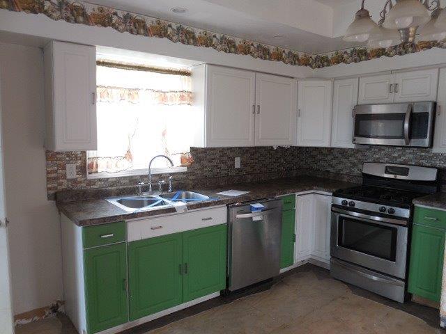 488 County Road 2100 North Danforth, IL 60930 - Photo 6 of 10 a kitchen with granite countertop a sink stove and microwave