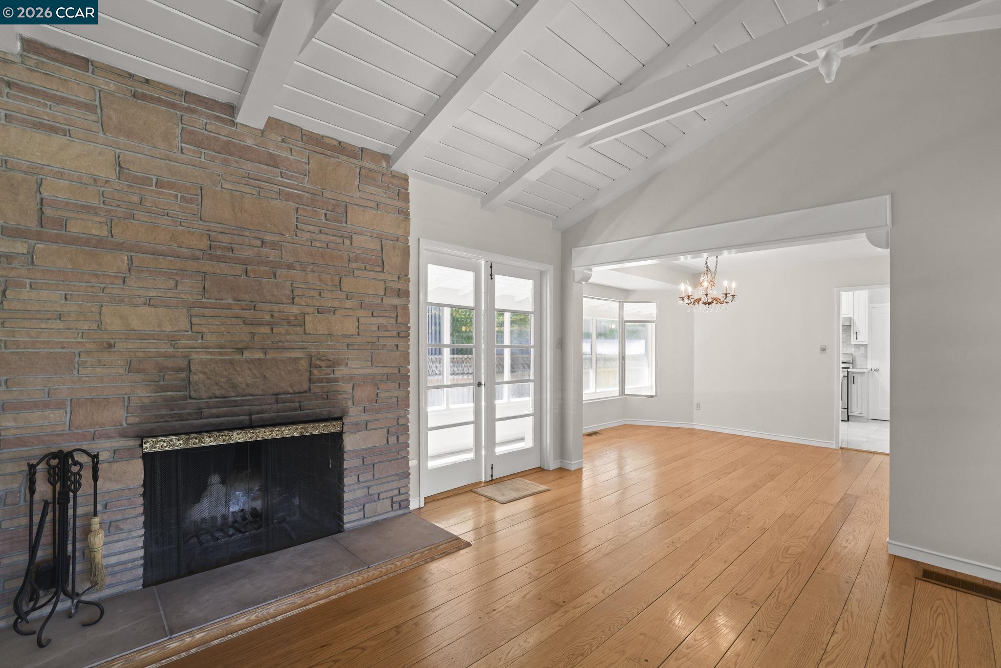 1051 San Rafael Street San Leandro, CA 94577 - Photo 6 of 26 a view of an empty room with glass door and wooden floor