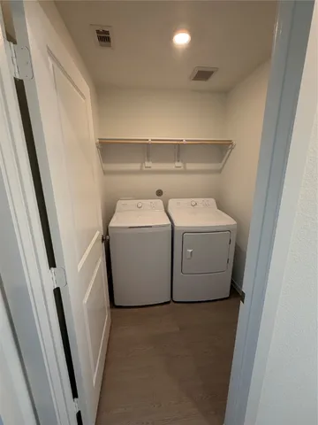 a utility room with dryer and washer