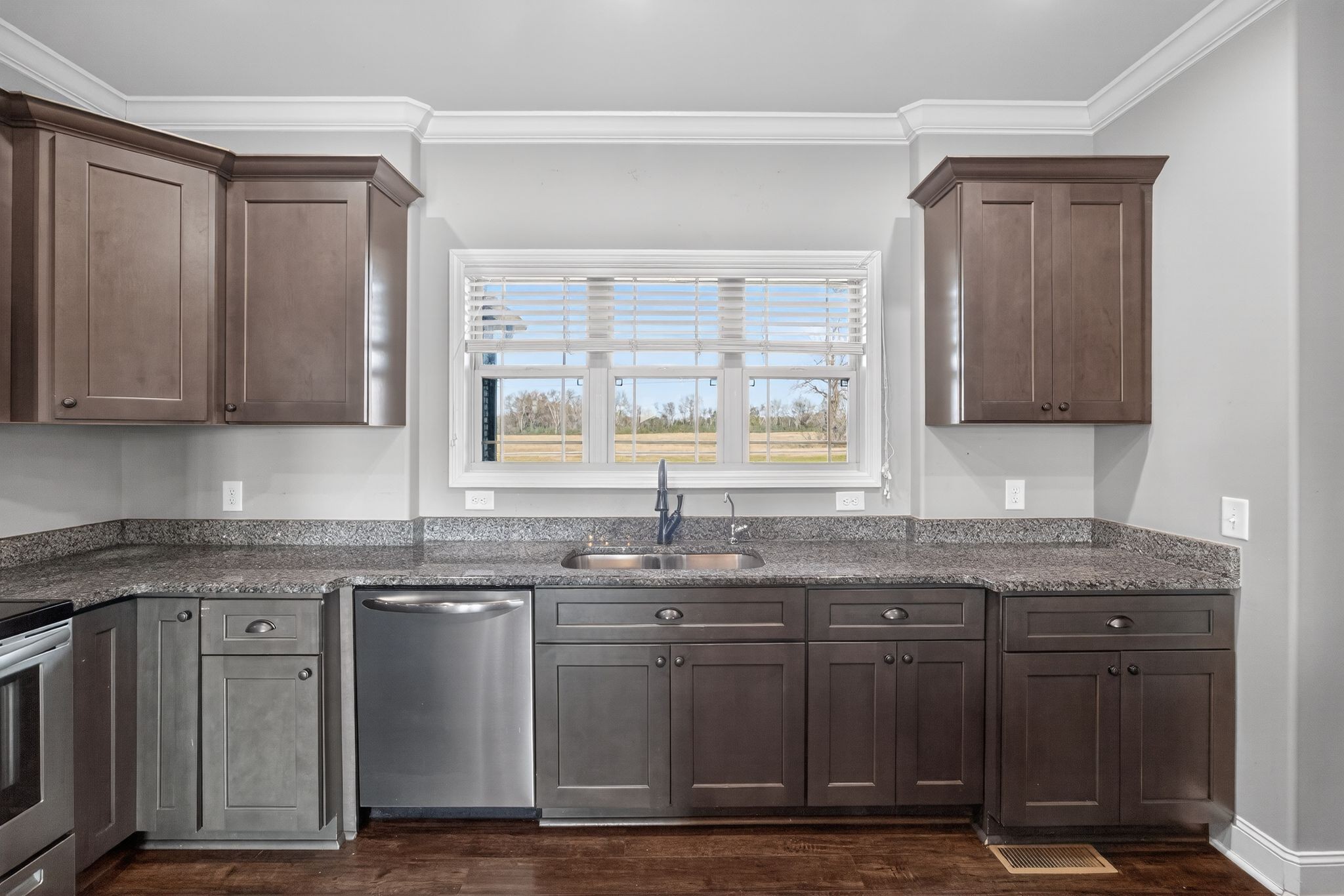 1347 Neil Road Chapel Hill, TN 37034 - Photo 13 of 36 a kitchen with granite countertop a sink stainless steel appliances and cabinets