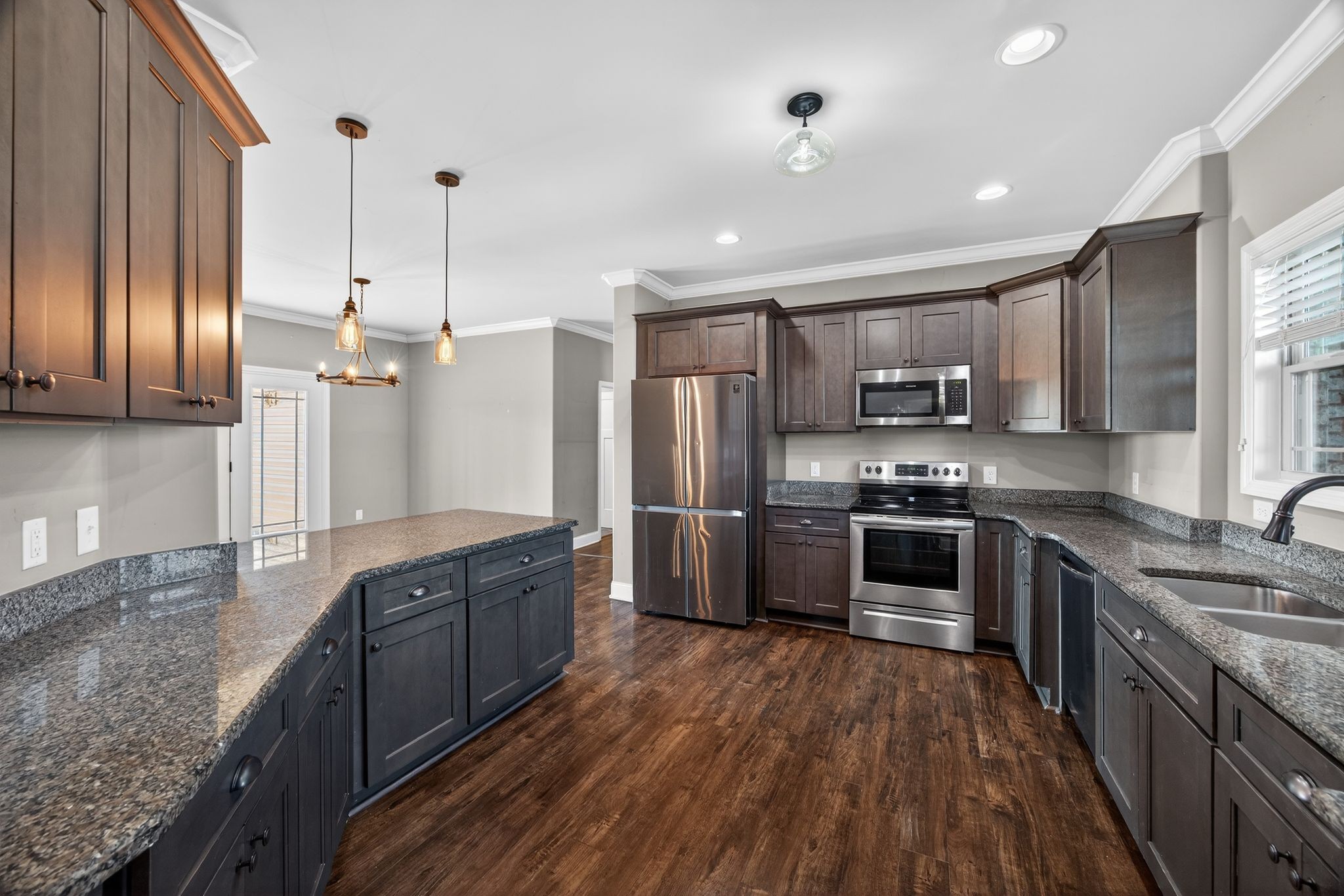 1347 Neil Road Chapel Hill, TN 37034 - Photo 15 of 36 a large kitchen with stainless steel appliances granite countertop a stove refrigerator and cabinets