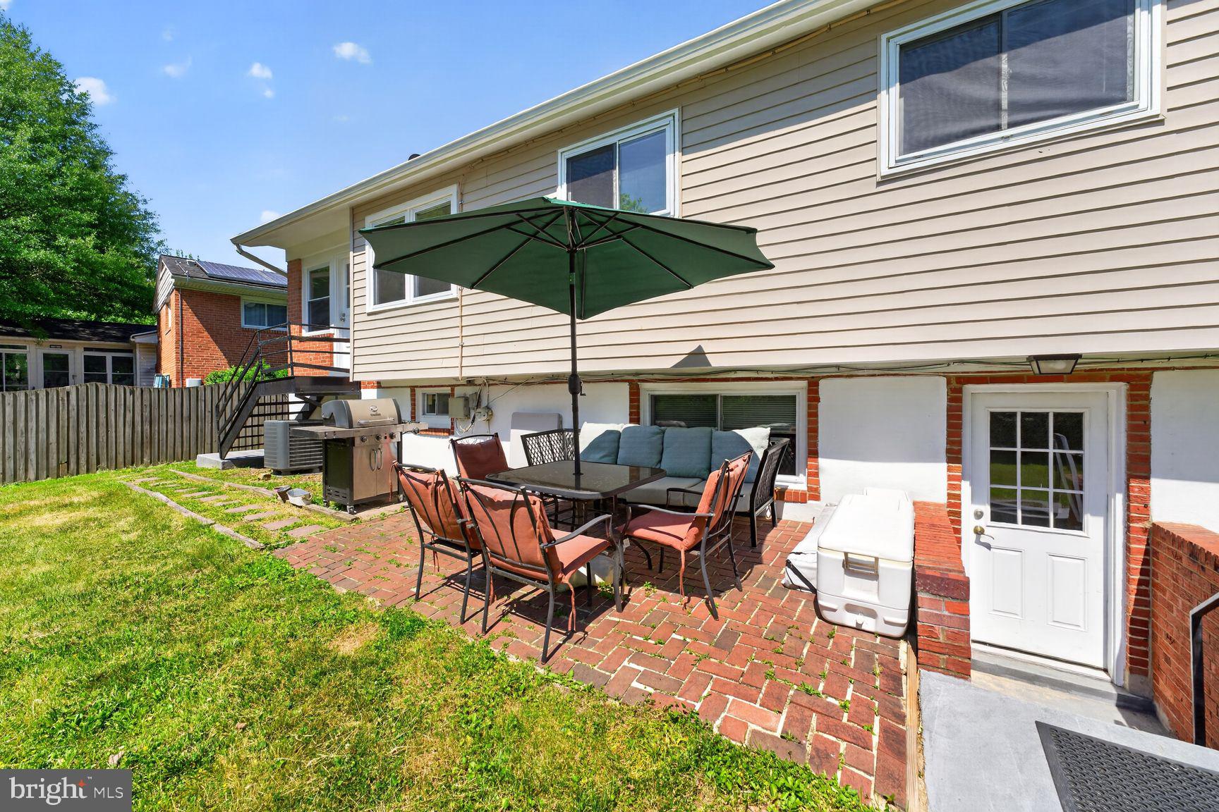 1104 Caddington Avenue Silver Spring, MD 20901 - Photo 28 of 35 a backyard of a house with table and chairs