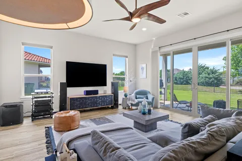 a living room with furniture and a large window