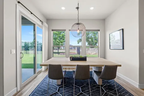 a spacious bedroom with a bed and window