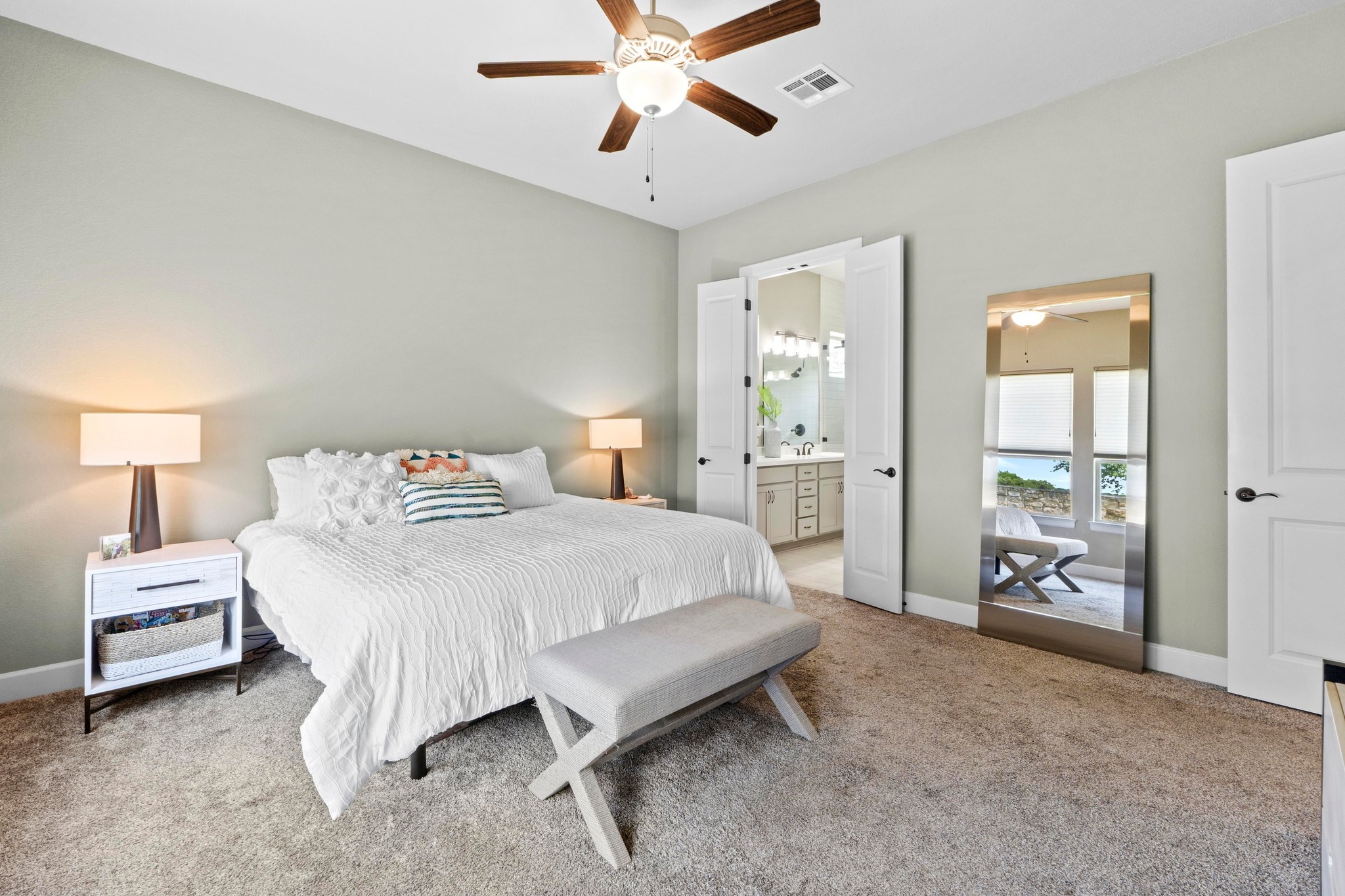 2609 Antalya Loop Leander, TX 78641 - Photo 16 of 40 a bedroom with a bed and a chandelier