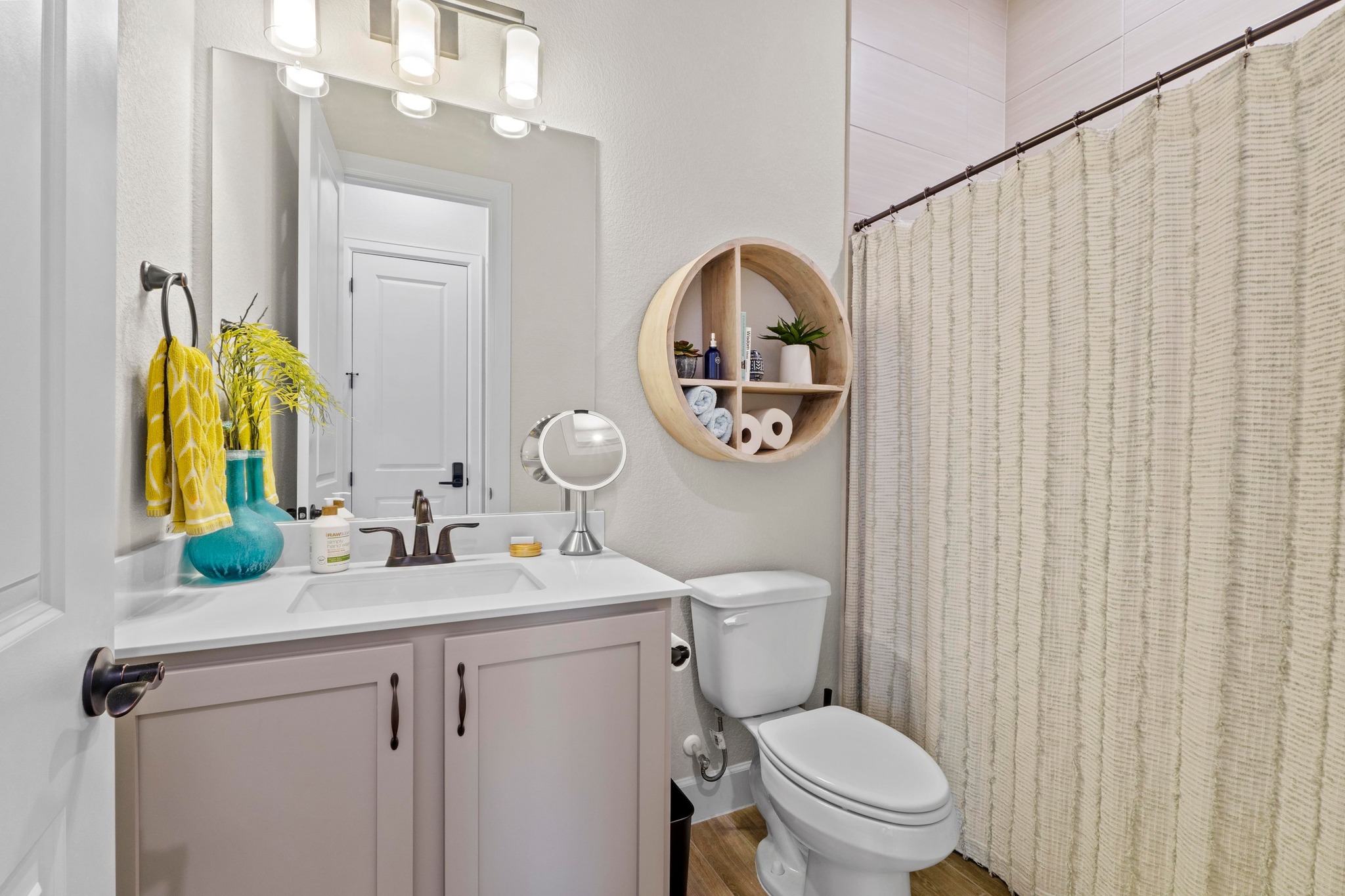 2609 Antalya Loop Leander, TX 78641 - Photo 22 of 40 a bathroom with a toilet sink vanity and mirror