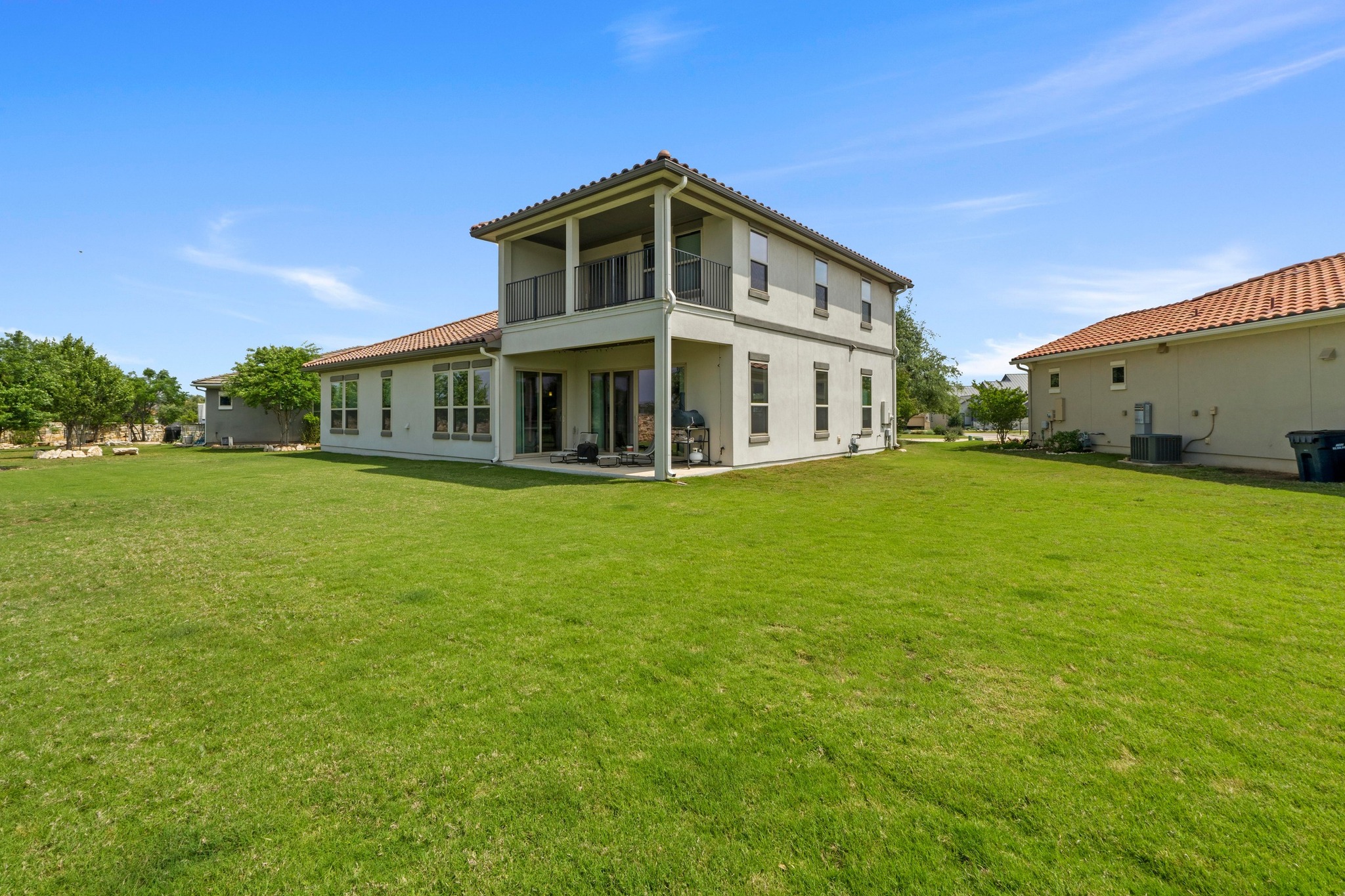 2609 Antalya Loop Leander, TX 78641 - Photo 32 of 40 a front view of a house with garden