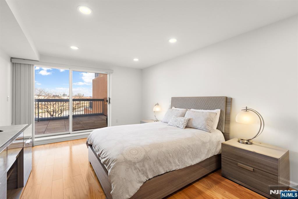 316 Nelson Court Edgewater, NJ 07020 - Photo 13 of 29 a bed room with a bed and window