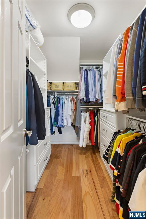 316 Nelson Court Edgewater, NJ 07020 - Photo 16 of 29 a view of walk in closet with clothes and shoes