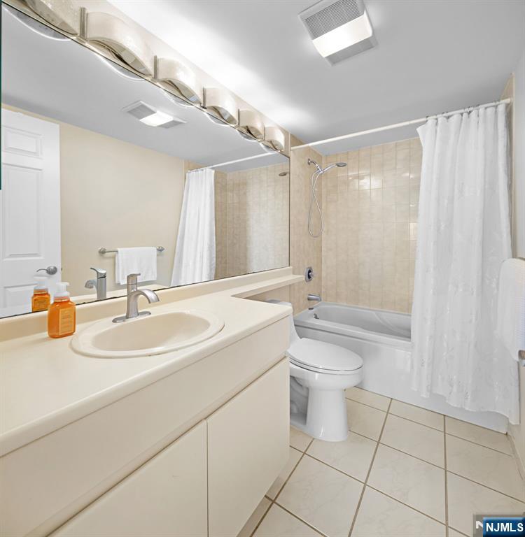 316 Nelson Court Edgewater, NJ 07020 - Photo 17 of 29 a bathroom with a sink a toilet and shower
