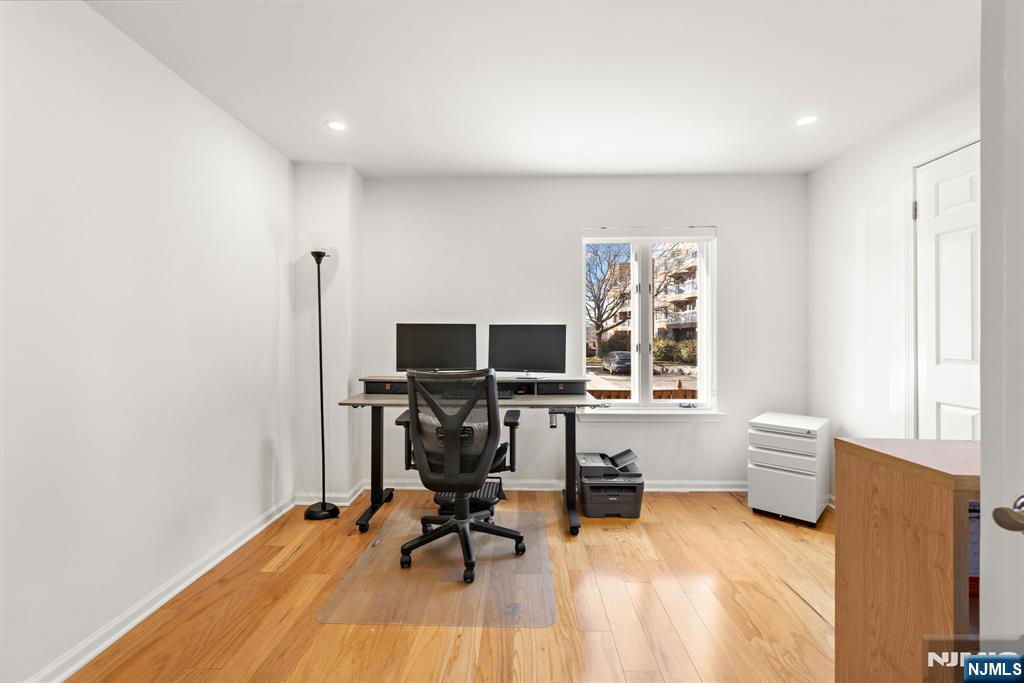 316 Nelson Court Edgewater, NJ 07020 - Photo 18 of 29 a view of a livingroom with workspace and a window