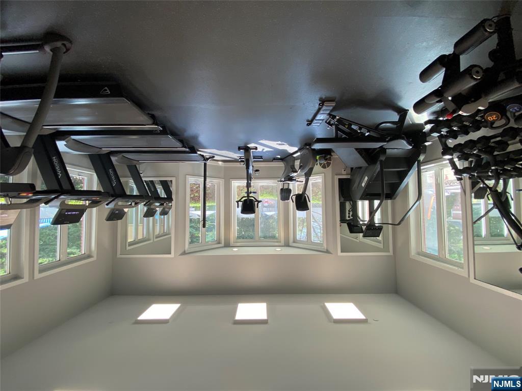 316 Nelson Court Edgewater, NJ 07020 - Photo 26 of 29 a view of a livingroom with gym equipment