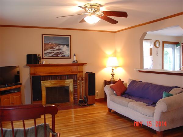 43 Johnson Road Arlington, MA 02474 - Photo 7 of 13 a living room with furniture a fireplace and a flat screen tv