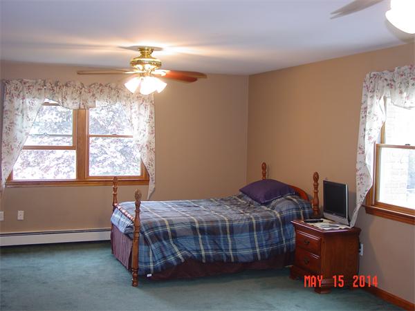 43 Johnson Road Arlington, MA 02474 - Photo 8 of 13 a bedroom with a bed and a window