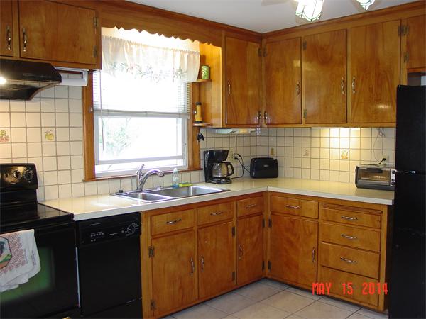 43 Johnson Road Arlington, MA 02474 - Photo 9 of 13 a kitchen with a sink window and cabinets