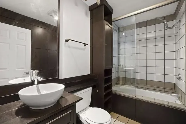 a bathroom with a sink and mirror