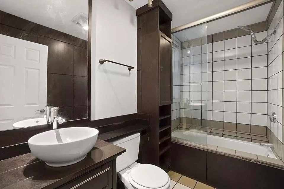 583 Massachusetts Avenue, Unit 5 Boston, MA 02118 - Photo 14 of 15 a bathroom with a sink and mirror