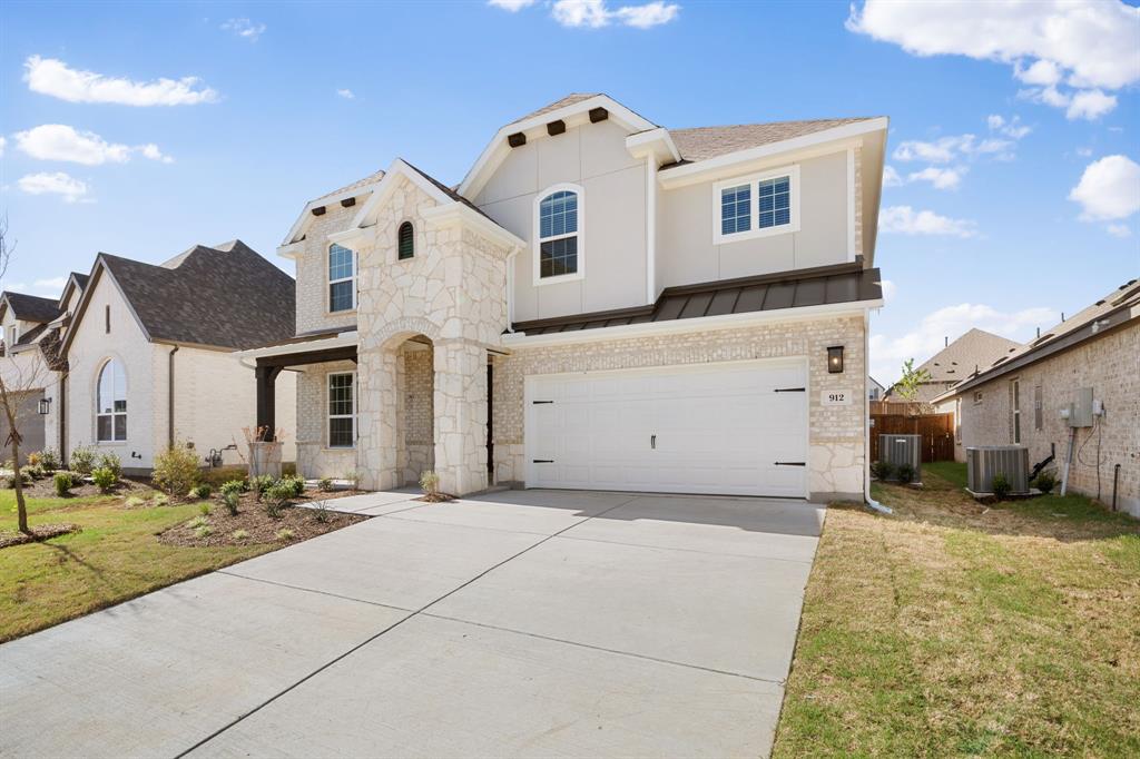 912 Alberta Spruce Road Justin, TX 76247 - Photo 3 of 35 a view of a white house with a large space in front of it