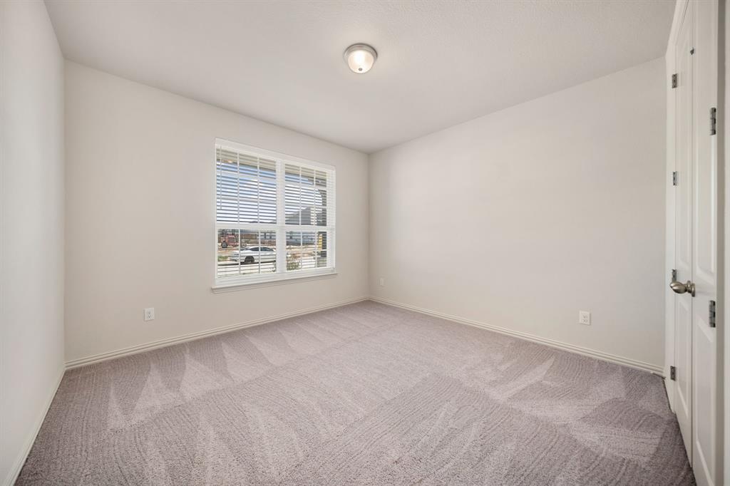 912 Alberta Spruce Road Justin, TX 76247 - Photo 7 of 35 an empty room with windows