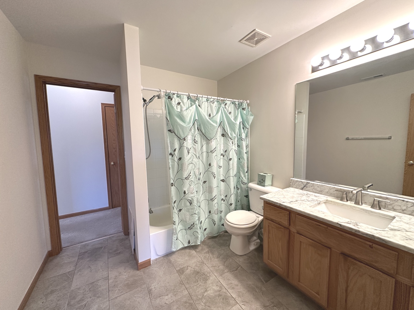 3503 Blue Ridge Court, Unit 3503 Carpentersville, IL 60110 - Photo 5 of 9 a bathroom with a granite countertop sink toilet and shower