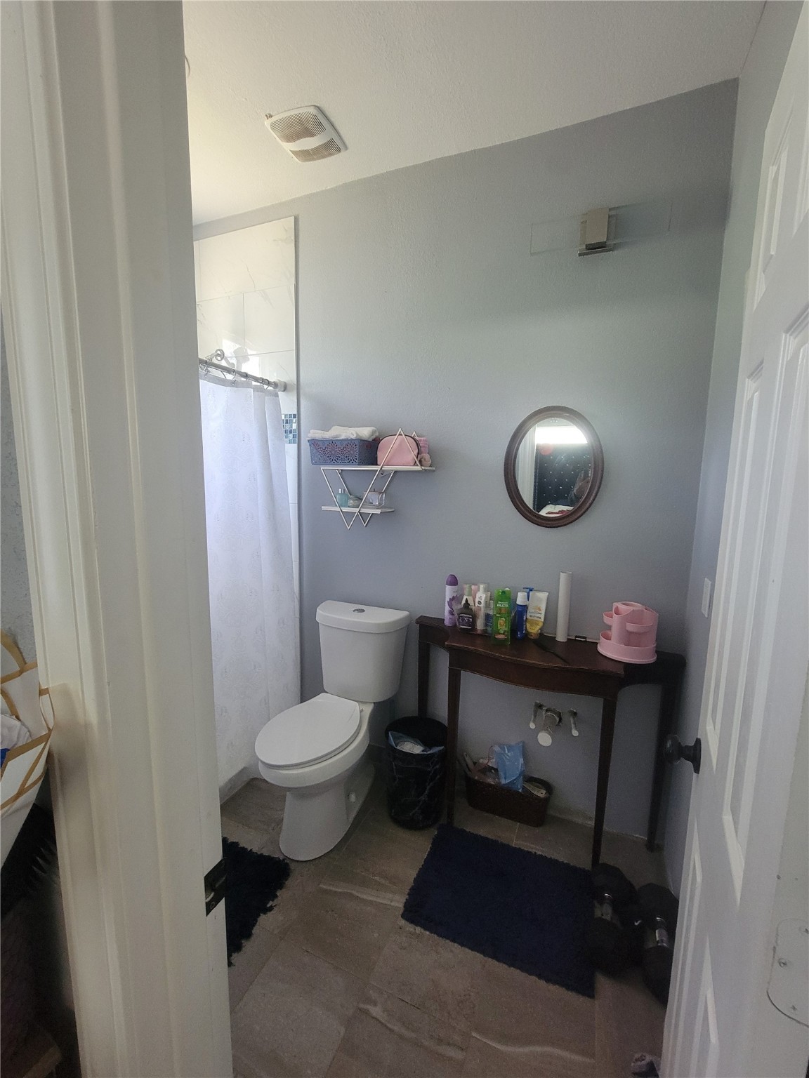 248 County Road 3572 Cleveland, TX 77327 - Photo 11 of 29 a bathroom with a sink mirror vanity and toilet