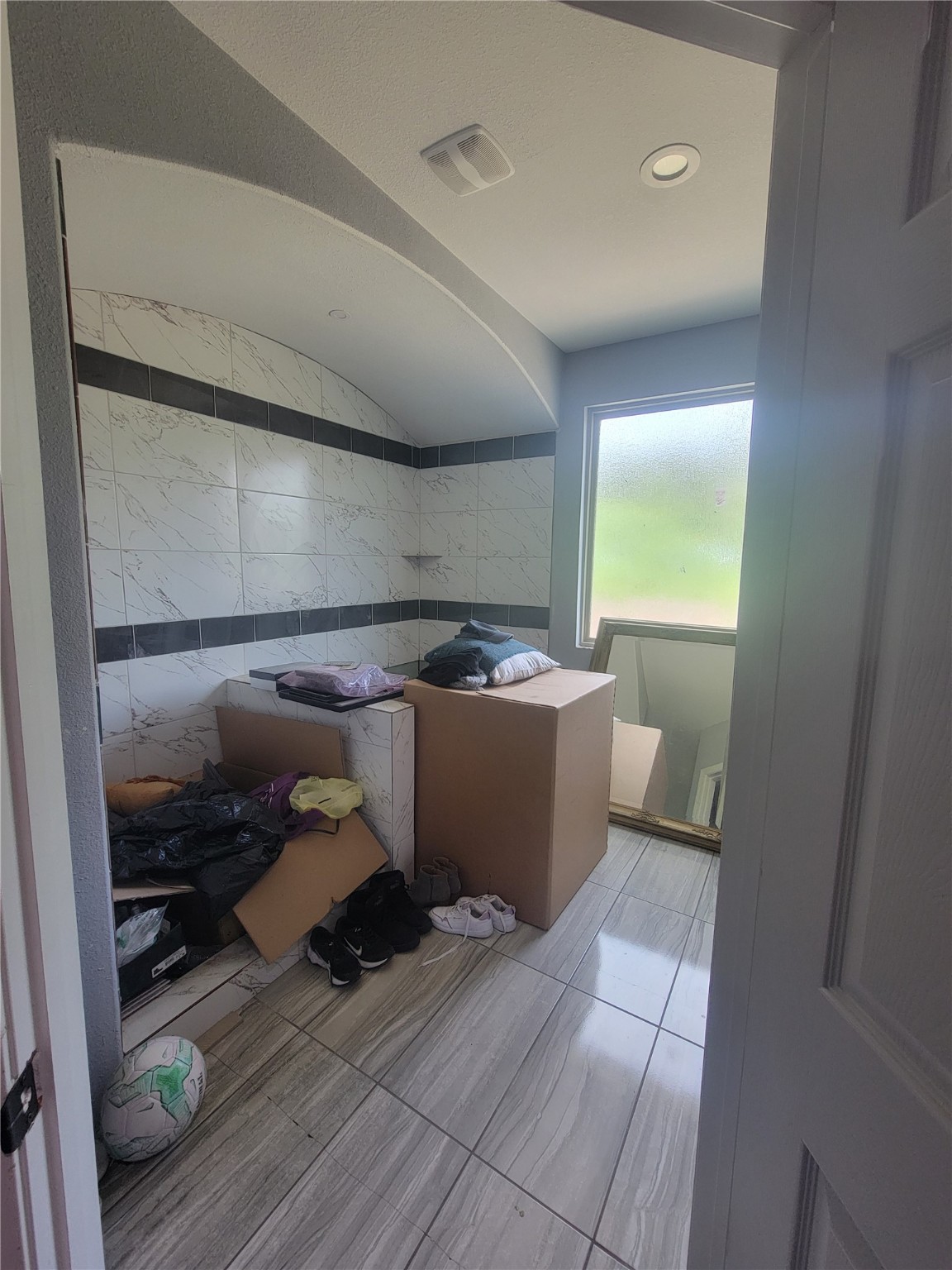 248 County Road 3572 Cleveland, TX 77327 - Photo 14 of 29 a room with storage and utility